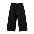 Black wide-leg GymNext pants with drawstring waistband and red logo, front view